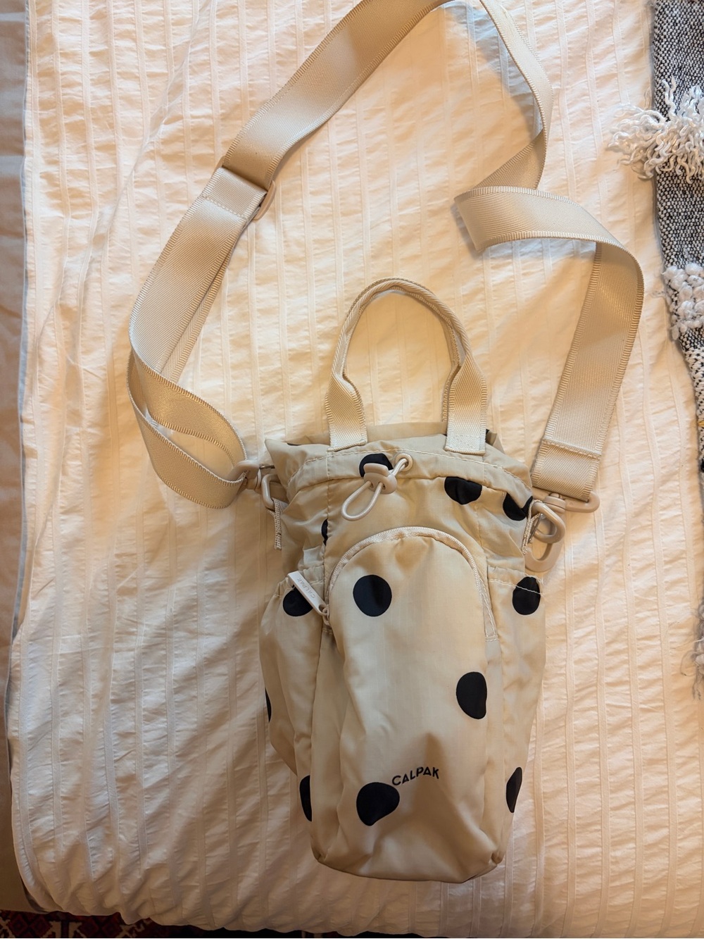 Calpak Beige Crossbody with Black Polka Dots